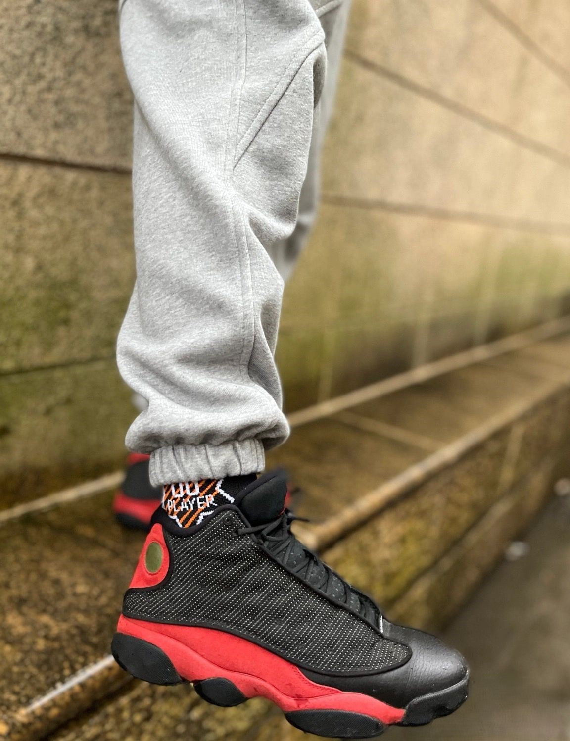Air Jordan 13 Retro; The legendary heritage colorway showcasing bold red suede paired with classic white leather