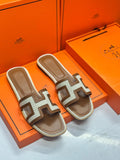 Hermès Oran Sandals – Iconic Elegance in Canvas & Leather